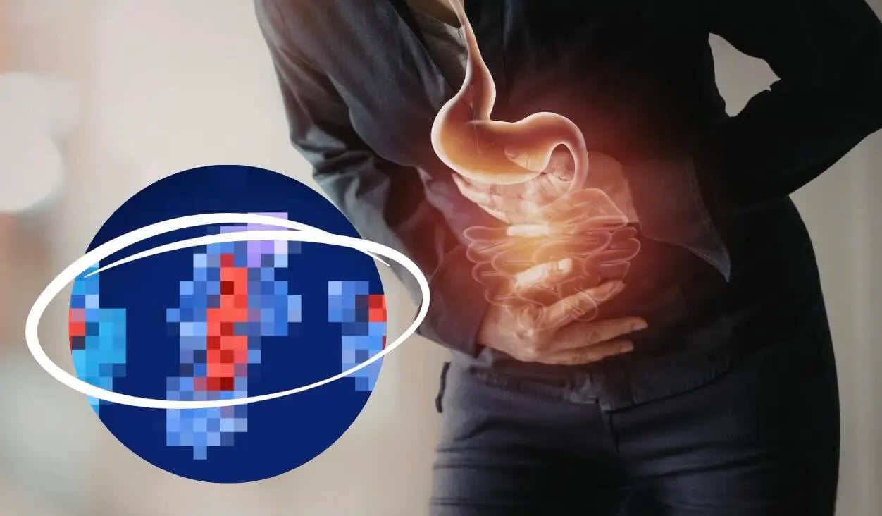 Frau mit Verdauungsbeschwerden nach dem Essen